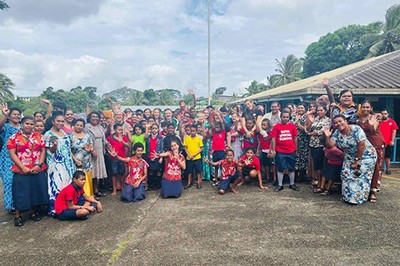 A group of students pose with locals in Fiji